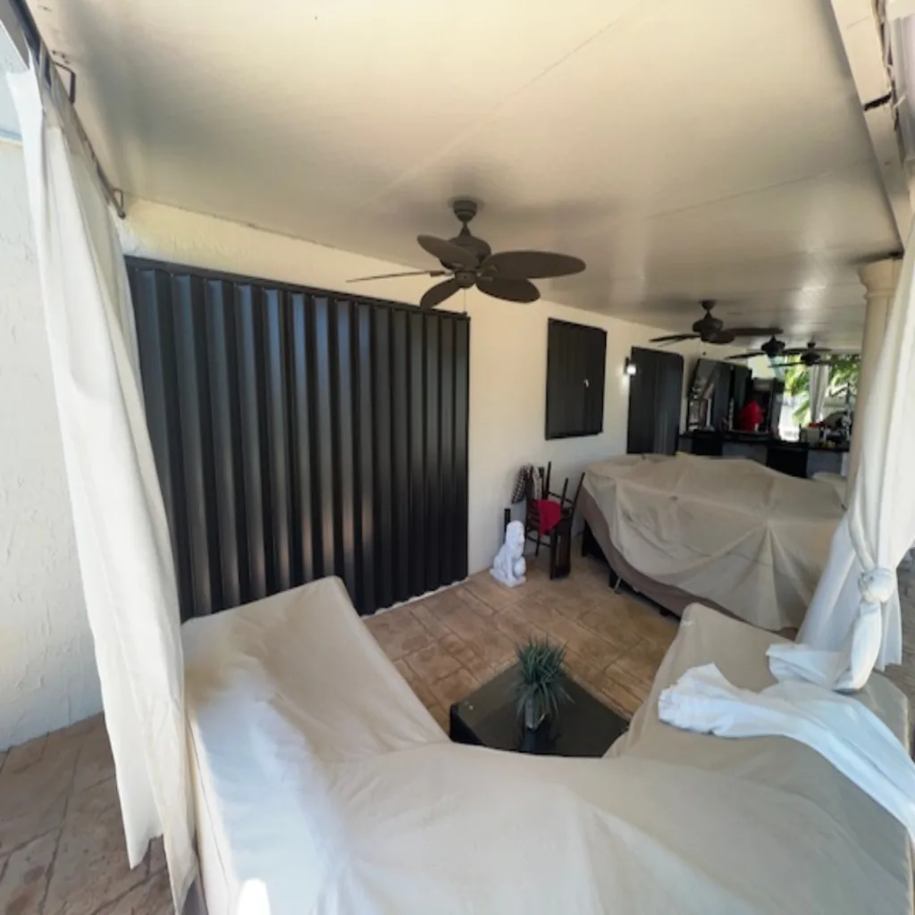 Wide patio opening protected by accordion shutters